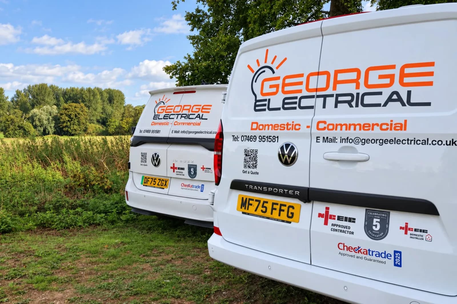The electric and diesel George Electrical vans parked side by side